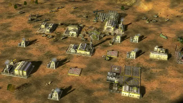An American base of pale buildings on desert ground, seen from above