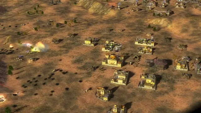 A spread of tan GLA buildings and vehicles on open desert ground