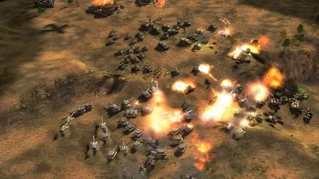 Dozens of tanks fighting on desert ground among explosions and burning wrecks